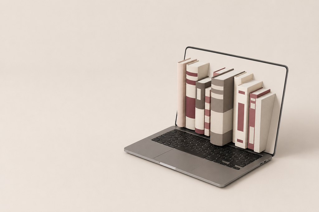 immagine con computer e libri